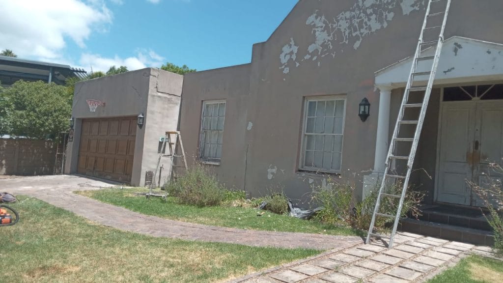 Ladder against a Cape Town house during exterior preparation and repainting