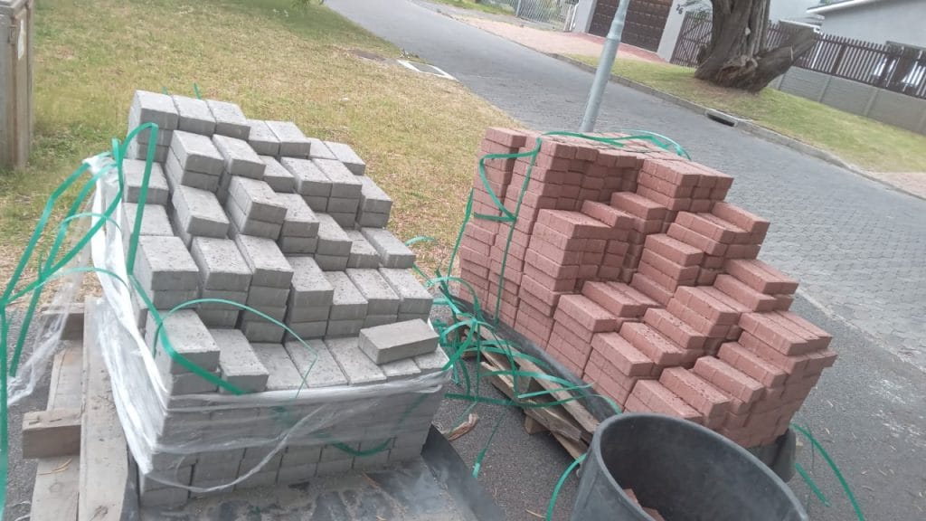 Pallets of clay paving bricks delivered on a driveway in Cape Town