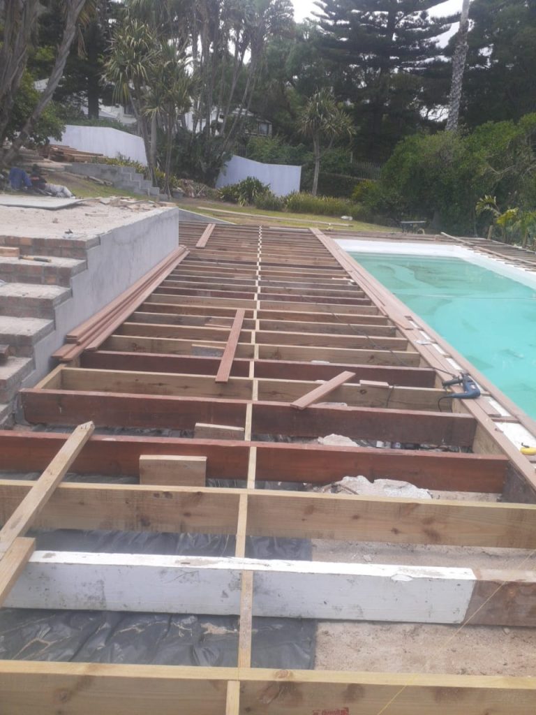 Timber deck construction beside a pool in Cape Town