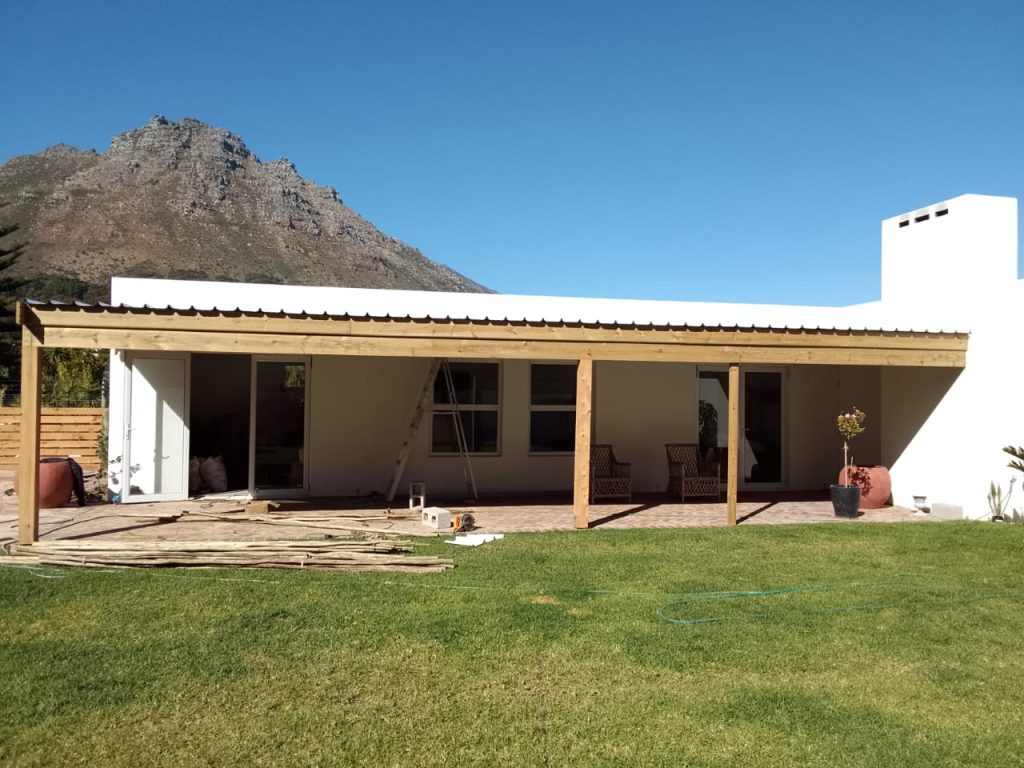 Long white single-storey home with lawn in Cape Town