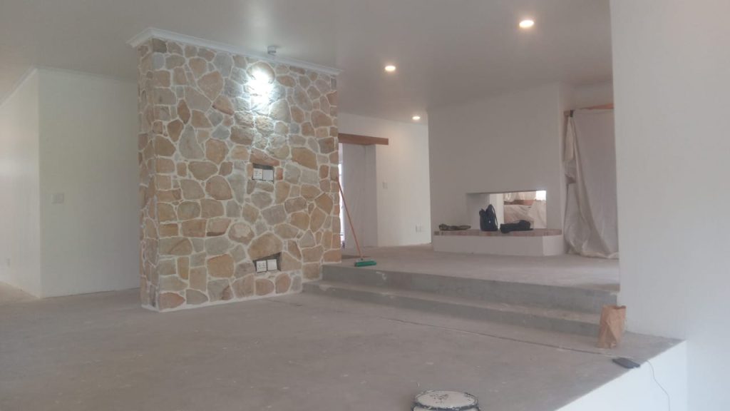 Renovated interior with a stone feature wall in Cape Town