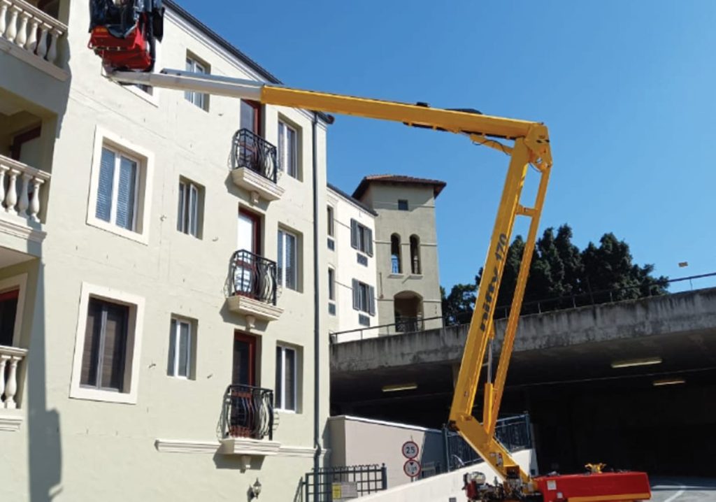 Apartment block construction with a cherry picker in Cape Town
