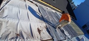 Roof protected with sheeting during repair work