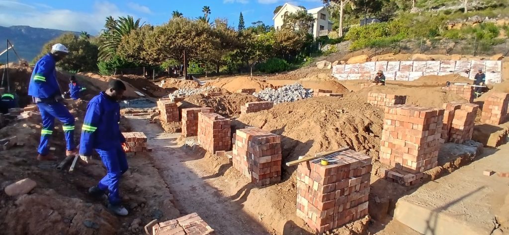 Builders laying foundation brickwork in Cape Town