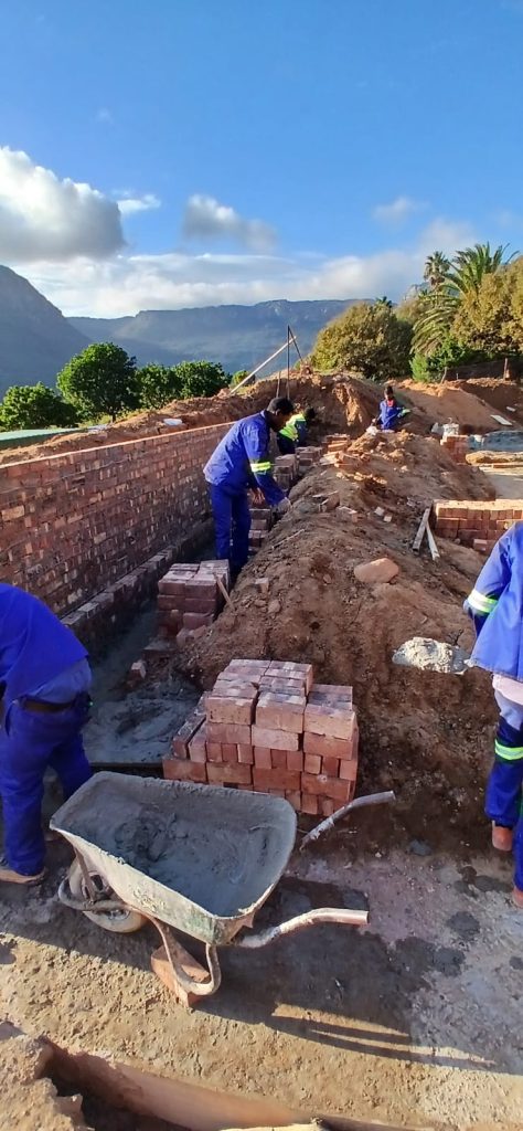 Builders working on house foundations in Cape Town