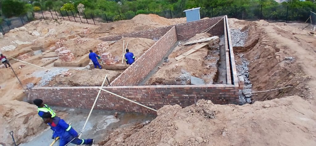 Worker setting out foundation footings in Cape Town