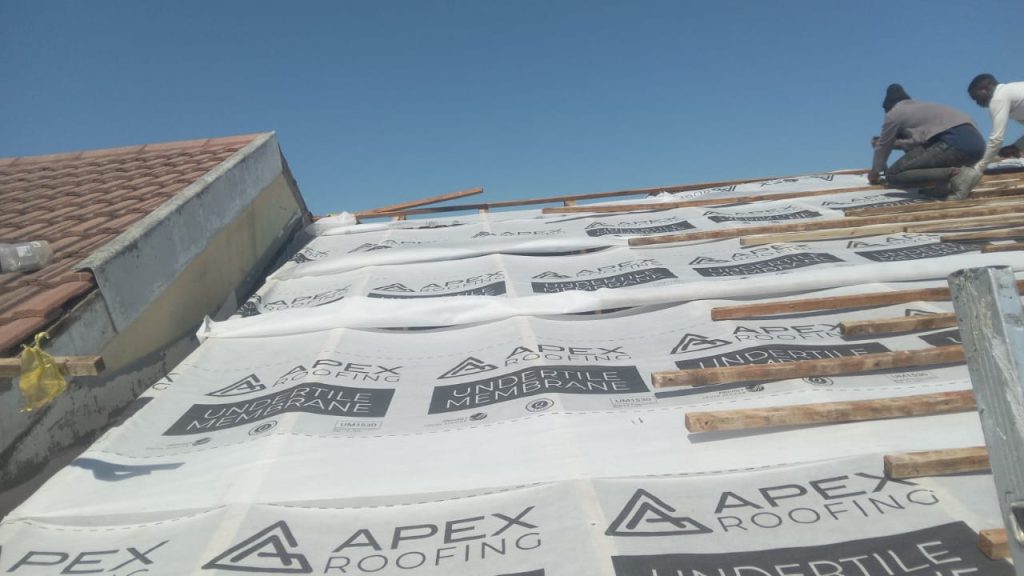 Undertile membrane laid over roof trusses during a Cape Town re-roof