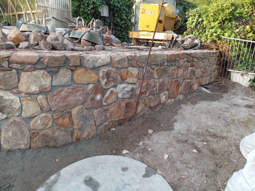 Stone retaining wall with paving on a sloping Cape Town property
