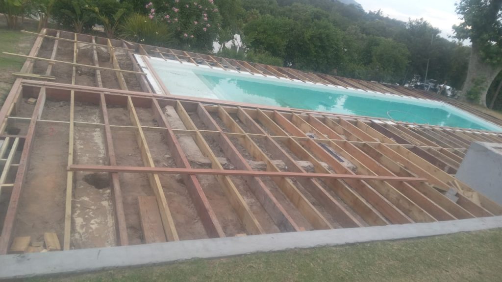 Foundation and deck frame beside a pool in Cape Town