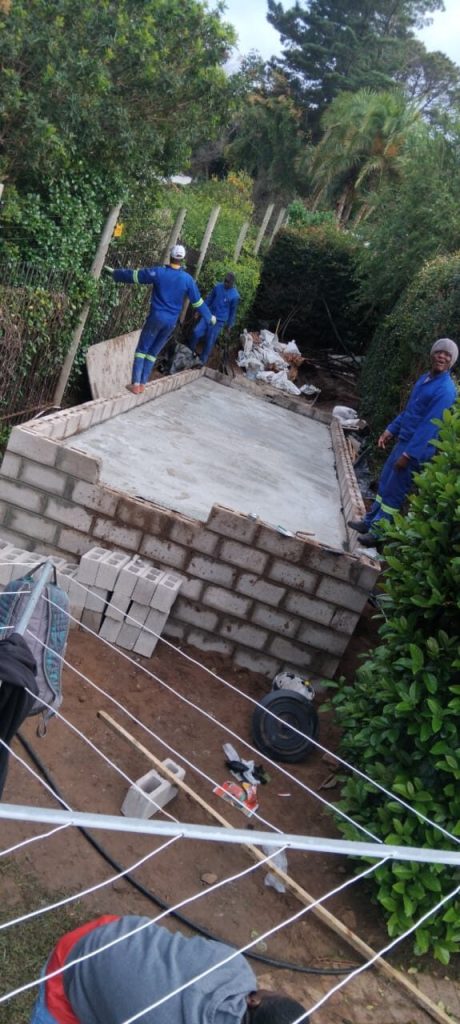 Bricklayers building a new wall during a Cape Town building project