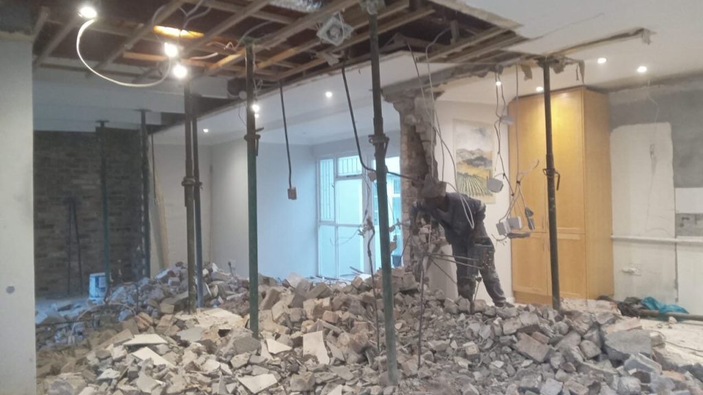 Interior opened up after structural wall removal with temporary propping in Cape Town