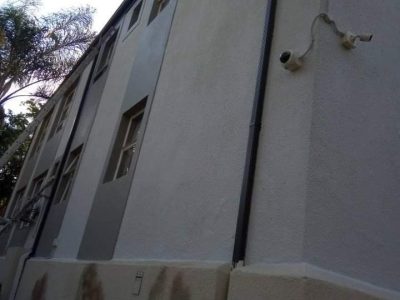 Damp-stained exterior wall before waterproofing in Cape Town