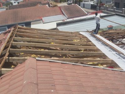 Roof stripped to timber battens during waterproofing work